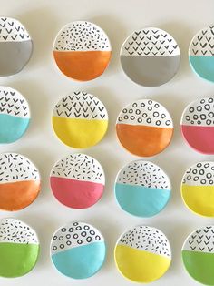 several different colored plates with designs on them are arranged in the shape of an egg