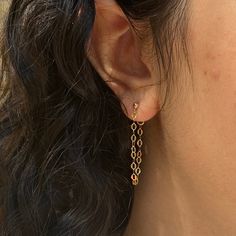 Dazzle up your favorite look with our Sparkle Chain Studs. We love to pair these with our sequin ear cuff for extra shine. Measures approx. 1.25" long14K Gold Filled. Trendy Gold Nickel-free Cartilage Earrings, Gold Dangle Cartilage Earrings For Party, Gold Hypoallergenic Dangle Cartilage Earrings, Gold Cartilage Earrings With Adjustable Chain For Everyday, Trendy Gold Dangle Cartilage Earrings, Gold Cartilage Earrings With Adjustable Chain, Trendy Gold Long Drop Earrings, Dainty Nickel-free Ear Cuff, Hypoallergenic Gold Plated Dangle Cartilage Earrings