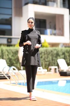 The black flounce details in the shoulder area are extremely striking, stylish, and unique. As BurkiniRemsa, we carefully complete each of our designs in our workshops with our educated designers who follow fashion. We created a difference in our product, which bears the dignity of this black color in the full coverage burkini category, with flounces. Moreover, thanks to its exclusive fabric, it is always suitable for swimming: Absorb water in no time! Fitted Black Sets With Ruffles, Black Fitted Ruffle Sets, Black Fitted Ruffled Sets, Fitted Black Ruffled Sets, Muslim Swimwear, Auckland, No Time, The Black, Black Color