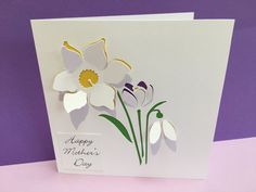 a greeting card with white and purple flowers on the front that says, happy mother's day