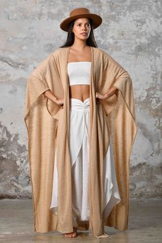 SAHMERAN Kimono Zhenabia, Image Flowy Bohemian Beige Kimono, Beige Flowy Bohemian Kimono, Beige Kimono For Beach In Fall, Bohemian One-size Cape For Summer, Bohemian Summer Cape One Size, Long Beige Kimono For Festival, Beige Long Kimono For Festival, Traditional Summer Wrap Kaftan, Beige Open Front Kimono As Beach Cover-up