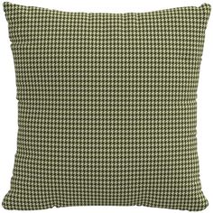 a green and white houndskin pillow on a white background with the words,'home is