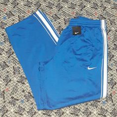 Mens Large Sports Sport Sportswear Athletic Athletics Apparel Streetwear Street Wear Fashion Style Colorful Logo Spellout Spell Out Swoosh Blue Sporty Joggers With Three Stripes, Blue Sports Joggers With Three Stripes, Blue Sportswear Joggers With Three Stripes, Blue Three Stripes Joggers Sportswear, Blue Sportswear Joggers For Jogging, Blue Athleisure Sweatpants With Three Stripes, Blue Jogging Pants With Three Stripes, Blue Sportswear Pants For Jogging, Blue Athleisure Sports Pants