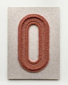 the letter o is made out of yarn