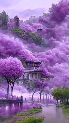 purple trees are in the foreground with buildings on top