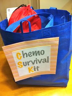 there is a blue bag that has some items in it and the words chemo survival kit written on it