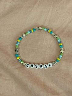 A hand-crafted glass bead friendship bracelet highlighting Chappell Roan's song "Casual"! A simple and cute way to show off your favorite song or a great concert accessory!  This bracelet is made with Czech glass beads, plastic letter beads, plastic spacer beads, and is on an elastic thread measured at about 10 inches in length for a relaxed/loose fit. If you would like the bracelet you order to be smaller or larger, please leave the requested size in inches in the personalization box!  All brac Casual Multicolor Friendship Bracelets For Everyday, Casual Hypoallergenic Friendship Bracelets, Casual Multicolor Beaded Bracelets For Everyday, Casual Everyday Friendship Bracelets, Casual Multicolor Everyday Friendship Bracelets, Casual Multicolor Stretch Bracelet For Everyday, Casual Adjustable Friendship Bracelets With Colorful Beads, Casual Multicolor Beaded Bracelets For Friendship, Casual Everyday Beaded Friendship Bracelets