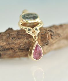 "14k solid gold necklace. Oval green Tourmaline, blue Sapphire and pink Tourmaline Teardrop, 3 colors stones dangle pendant. This unique gold necklace is handmade by me. The pendant is small and delicate and yet, visible and tend attention. It is an everyday gold necklace that you can wear with every style. It a perfect as a love birthday gift. ** 14k Solid Gold ** Pink Tourmaline ** 2 Small Blue Sapphires 1.3 m\"m ** Oval light Green Tourmaline 6*4 m\"m This pendant can be a beautiful set with Pear-shaped Tourmaline Jewelry As A Gift, Pear-shaped Tourmaline Jewelry For Gift, Pear-shaped Tourmaline Jewelry Gift, Pear-shaped Tourmaline Gemstone Jewelry, Gift Pear-shaped Tourmaline Jewelry, Solid Gold Necklace, Gift For Wife, Green Tourmaline, Pink Tourmaline