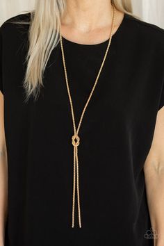 A glistening strand of lengthened gold popcorn chain delicately knots at the chest, creating an edgy tasseled pendant. Features an adjustable clasp closure. Featured inside The Preview at ONE Life! Sold as one individual necklace. Includes one pair of matching earrings. P2ED-GDXX-119XX Chic Gold-tone Lariat Necklace, Adjustable Lariat Chain Necklace For Parties, Chic Gold Jewelry With Adjustable Length, Chic Gold Lariat Long Necklace, Gold Lariat Long Necklace, Elegant Gold Chain Lariat Necklace For Party, Gold Dangle Lariat Necklace For Parties, Gold-tone Necklaces With Adjustable Chain For Parties, Chic Party Lariat Necklace With Dangle