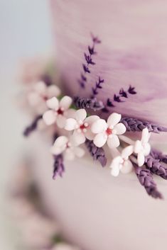 a close up view of a cake with flowers on it