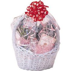 a white basket filled with lots of different types of items in it's wrapper