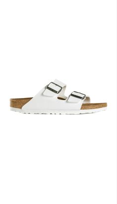 White leather ‘Arizona’ Sandals from Birkenstock. Classic Footbed Sandals For Summer Vacation, Classic Slip-on Footbed Sandals For Summer, Classic Summer Footbed Sandals For Vacation, Classic White Sandals For Vacation, Classic Footbed Sandals For Vacation In Spring, Classic Footbed Sandals For Spring Vacation, Classic Footbed Sandals For Beach In Summer, Classic Footbed Sandals For Summer Beach, Classic Spring Footbed Sandals For Vacation