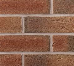 a brick wall that is made out of red bricks and has no mortars on it