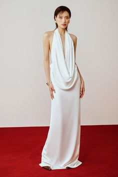 This luxurious dress is crafted from high-quality silk satin for a smooth and elegant look. The cowl neck adds a touch of sophistication while the straight cut and floor-length design flatters all body types. This dress is a timeless addition to any wardrobe, perfect for any formal occasion. High Cowl Neck Dress, Pre-draped Satin Maxi Dress With Cowl Back, Sleek Satin Silk Floor-length Dress, Sleek Silk Floor-length Evening Dress, Formal Satin Maxi Dress With Cowl Neck, Chic Satin Cowl Back Dress Formal, Satin Cowl Neck Maxi Dress For Formal Occasions, Satin Maxi Dress With Cowl Neck For Formal Events, Chic Satin Maxi Dress With Cowl Neck