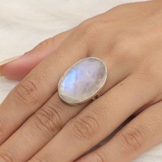 "Rainbow Moonstone Ring, 925 Sterling Silver Ring, Healing crystal Ring, Halloween Jewelry, Handmade Silver Ring, Birthday Gift For Sister. Gemstone Name - Rainbow Moonstone . Stone Quality - AAA  Ring Weight - 8.77 gm  Ring Length -2.6 cm Ring Width - 1.8 cm Stone Shape - As shown in the picture. Ring Size - All Ring Size Available.  We serve complete 925 sterling silver Jewelry and genuine properties of the stone.  The products are dispatched from the small business from UK. Product Quality and Packaging - Our all products are 925 Silver Stamped which shows that the product is genuine and authentic .The products are dispatched from the small business from UK so you get the product on time and the product packaging comes in bubble foil wrap with all the precautions taken primarily that yo Magical Sterling Silver Moonstone Ring Gift, Magical Sterling Silver Crystal Ring For Gift, Magical Moonstone Ring As A Gift, Magical Moonstone Rings As A Gift, Magical Moonstone Rings For Gifts, Handmade Magical Moonstone Ring In Sterling Silver, Mystical Oval Crystal Ring As Gift, Moonstone Crystal Ring With Large Stone For Gift, Magical Style Crystal Ring With Gemstone