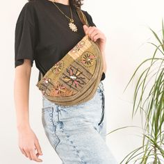 Embrace your inner free spirit with our Safari Green Handmade Patchwork Crossbody Bag! This unique bag is a beautiful blend of hippie and boho vibes, crafted with love in Nepal by skilled artisans. We use up-cycled cotton fabrics to create a one-of-a-kind patchwork design that's both vibrant and eco-friendly. 🌼 PRODUCT DETAILS: - Lovingly Handcrafted in Nepal - Made from 100% Cotton - Adjustable strap for comfortable carrying - Secure zipper closure keeps your belongings safe - Interior pocket Bohemian Rectangular Belt Bag For Everyday Use, Bohemian Beige Bag With Removable Pouch, Casual Beige Bag For Festival, Bohemian Belt Bag For Everyday Use, Bohemian Ethically Sourced Shoulder Bag For Travel, Bohemian Pouch Bag For Festival, Eco-friendly Tote Bag For Festivals, Bohemian Beige Hobo Bag With Removable Pouch, Bohemian Festival Pouch Bag