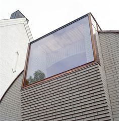 the corner of a building with a large window