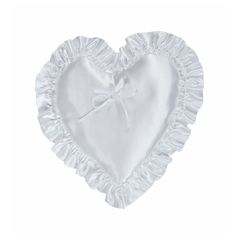 a white heart shaped pillow with ruffled edges