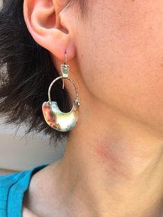 "A fun pair of drop earrings with an ancient flair. Hand sawn & domed crescents hang from an arch of sterling silver that has been filed with notches. They hang from a tiny textured riveted bail with an ear wire. They are oxidised and brushed for a rich, satin and dark finish. They measure 2\" x 1\"" Asheville Nc, Colby, Asheville, Ear Wire, Crescent, Dangle Drop Earrings, Arch, Drop Earrings, Sterling Silver