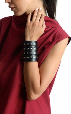 Studded Leather Cuff - METBR21 A modern leather long bracelet with many accents that make it a unique piece. The cuff is studded for a more interesting look and also has four decorative straps that go all over it. It goes with many outfits making them look better so do not wait - get it now! The size of the item is about 8 inches / 20 cm to 3.5 inches / 9 cm . It closes with all four straps that have a belt finish. NOTE! Since every piece is entirely handmade no two items are exactly the same wh Leather Pendant, Genuine Leather Bracelet, Hand Accessories, Black Leather Bracelet, Leather Wristbands, Heart Choker, Leather Bracelets, Leather Work, Studded Leather