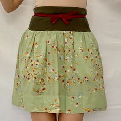 A Lovely Summer Skirt From Italian Brand Caractre C24. Cotton Lovely Colorful Small Flowers On A Most Beautiful Shade Of Green. Feels Soft And Very Comfy. Casual W: 14" L: 19.5" Plain Weave Floral Design Elasticized Waist Logo Plate 2 Side Pockets With Zippers! Military Green Elasticized Waist. Made In Italy. Size: 42/M/6 Fun Light And Colorful Skirt To Have In Your Closet For Summer Days! Caractre C24 Mini Skirt~ Green Floral ~ Light Coton ~ Italy ~Sz. 42/M~ Summer E 2232 6 Oz Green Flowy Cotton Skirt, Spring Green Cotton Skirt, Green Cotton Skirt For Spring, Spring Green Skirt With Elastic Waistband, Green Skirt With Elastic Waistband For Spring, Summer Mini Skirt With Waistband, Casual Skirt With Waistband For Spring, Green Lined Mini Pleated Skirt, Green Skirted Skort With Lined Skirt