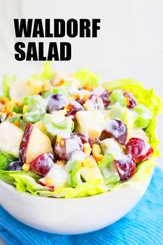 a white bowl filled with salad sitting on top of a blue towel