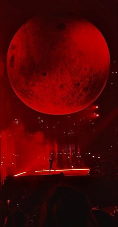 the stage is lit up with red lights