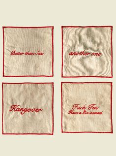 four napkins with embroidered words on them