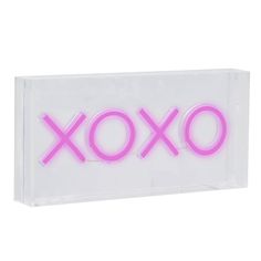 the word xoxo is lit up in pink neon lights on a clear acrylic box