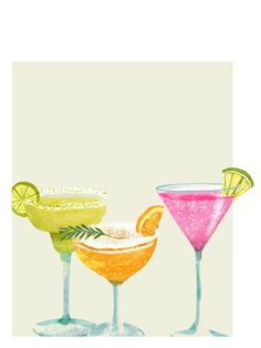 three different colored cocktails sitting next to each other