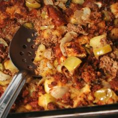 a casserole dish with potatoes and meat in it, ready to be eaten