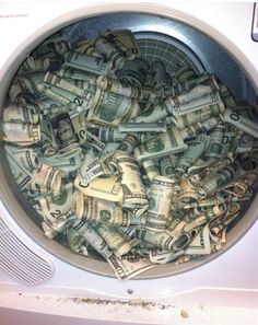 a washing machine filled with lots of money