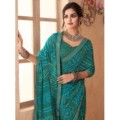 Blue colored saree is made from chiffon fabric which is highlighted with beautiful bandhani printed work with banarasi border as shown. comes along unstitched chiffon printed blouse piece which you can customise as per your design/style. Occasion - You can wear this saree for casual and daily. Note:- The actual product may differ slightly in color and design from the one illustrated in the images when compared with computer or mobile screen. Measurements: Saree : Chiffon : 5.5 Mtrs Blouse : Chiffon : 0.8 Mtr Material: Chiffon Stitch Type: Unstitched Country of Origin: India Care Guide: Dry Clean Printed Chiffon Saree, Saree Chiffon, Blouse Chiffon, Baby Skin Care, Mobile Screen, Chiffon Saree, Georgette Sarees, Print Chiffon, Silk Chiffon