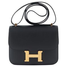 Hermès Constance 18cm in Black Epsom Leather with Gold Hardware U Stamp / 2022 Accompanied by: Original receipt, Hermes box, Hermes dustbag, care card and felt Measurements: W 7.25" x H 6.25" x D 2.25" Adjustable shoulder strap: 16.5" Hermes Handbags Constance, Hermes Constance Bag, Brown Hair Looks, Hermes Constance, Hermes Box, Care Card, Hermes Bags, D 2, Handle Bag