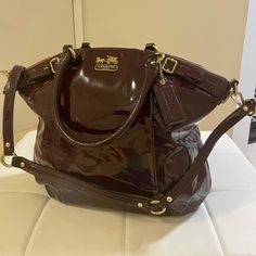 Brand New, Never Used, And Authentic Coach Patent Leather Bag In Burgundy. Also Comes With The Dust Bag. Designer Coach Bag In Burgundy, Designer Burgundy Coach Bag, Designer Coach Shoulder Bag In Burgundy, Designer Coach Burgundy Shoulder Bag, Chic Burgundy Coach Bag, Coach Burgundy Shoulder Bag With Removable Pouch, Coach Burgundy Bag With Adjustable Strap, Coach Burgundy Satchel Shoulder Bag, Coach Burgundy Satchel Bag