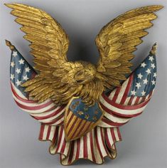 an eagle statue with the american flag on it