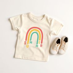 Looking for a cute tee for your kids? We have the perfect Rainbow Summer graphic tee addition to their closet! Also available in toddler tees. Cute Letter Print T-shirt For Playtime, Casual Letter Print T-shirt For Playtime, Screen Print Short Sleeve T-shirt For Playtime, Unisex Short Sleeve T-shirt For Playtime, Playful Rainbow Graphic Print T-shirt, Pre-shrunk Cotton Rainbow T-shirt, Funny Print Tops For Summer Playtime, Funny Print Tops For Spring Playtime, Spring Season Graphic Tee For Playtime