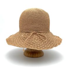 Toyo Straw Adjustable Chin Strap One Size Fits Most Spot Clean With Water Our popular Frida straw hat is the perfect accessory to help keep you cool in hot weather. It offers great outdoor protection against UV rays. The Frida sun hat is the perfect accessory to take on your adventures because it travels well in your suitcase. It is bendable, crushable and packable to help conserve space in your luggage and it easily unfolds and retains it shape when you arrive at your destination. The wire brim