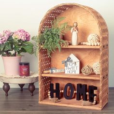 a wicker shelf with some plants on it and a potted plant in the corner