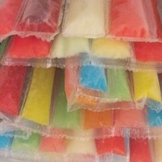 many different colored candies in plastic bags