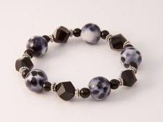 Jet Black and Dalmation Bead Stretch Bracelet Casual Black Jewelry With Spacer Beads, Black Bracelets With Large Beads For Gift, Black Bracelets With Large Beads As Gift, Black Beads Stretch Bracelet For Jewelry Making, Casual Black Beaded Bracelets With Large Beads, Casual Black Beaded Bracelet With Large Beads, Black Stretch Bracelet With Faceted Beads As Gift, Black Stretch Bracelet With Faceted Beads For Gift, Black Stretch Bracelet With Faceted Round Beads