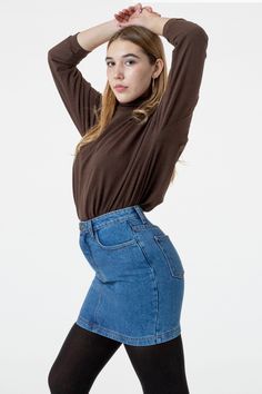 Our denim mini skirt is here, made of 100% cotton, heavy denim. This style features two front pockets and two in the back and is fitted throughout. Pair this style with tights and your favorite turtleneck style for the winter and wear it year-round with a cropped baby tee in the summer. This garment runs true-to-size and has a high waisted fit. Made in Los Angeles, Calif. Our experienced sewers earn up to $25 an hour and no less than $16; additionally workers have healthcare benefits for less th Fitted High Waist Denim Skirt For Fall, Fitted High-waist Denim Skirt For Fall, Trendy Fitted Denim Skirt For Winter, Trendy Fitted Denim Skirt For Work, High Waist Cotton Denim Skirt For Winter, Fitted Dark Wash Mini Skirt For Fall, High Rise Dark Wash Mini Skirt For Fall, Fitted Denim Skirt In Medium Wash For Fall, Stretch Denim Mini Skirt For Fall