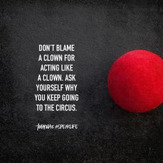 a red ball sitting on top of a black surface next to a quote from pope