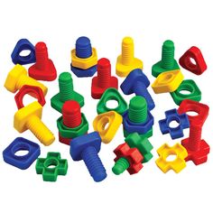 many different colored plastic toys are arranged in the shape of letters and numbers on a white background