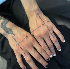 a woman's hand with tattoos on it and the words written across her fingers