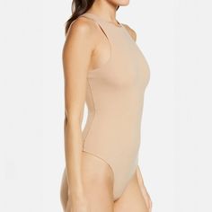 A classic. everyday style. this High Neck Bodysuit provides coverage and supportive stretch that hugs your body. This bodysuit is the perfect base layer and features a high cut leg opening and thong back that remains invisible under clothing.High Neck (Front And Back). Fabric Double Layered. Sporty Neckline. High Cut Leg Opening. Thong Back Remains Invisible Under Clothing. Cotton Gusset. Snap Closure76% Polyamide / 24% ElastaneMachine Wash Cold. Non Chlorine Bleach. Cool Iron. Do Not Dry Clean High Cut Bodysuit With Built-in Bra, Second-skin Seamless One-piece Bodysuit, High Stretch Smoothing One-piece Bodysuit, Sleek High-cut Bodysuit With Minimal Stretch, Solid High Cut Lined Bodysuit, Solid Color Backless Bodysuit With Minimal Stretch, Solid Color Minimal Stretch Backless Bodysuit, Seamless Second-skin Bodysuit With High-cut Leg, Seamless Second-skin High-cut Leg Bodysuit