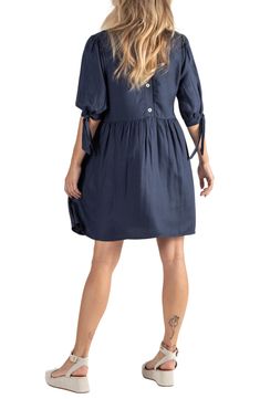 Stay effortlessly stylish in a breathable babydoll dress with a bump-friendly waistline and hidden panels for easy, discreet nursing access once baby arrives. Back button closure V-neck Three-quarter sleeves with tie cuffs 87% viscose, 13% wool Machine wash, tumble dry Imported Nursing Friendly Short Sleeve Dresses For Daywear, Daywear Nursing Friendly Dress With Short Sleeves, Nursing Friendly Short Sleeve Daywear Dresses, Short Sleeve Nursing Friendly Day Dress, Summer Nursing Friendly Dress For Daywear, Casual Maternity Mini Dress, Casual Maternity Dress In Solid Color, Casual Solid Color Maternity Dress, Nursing Friendly Knee-length Summer Dresses