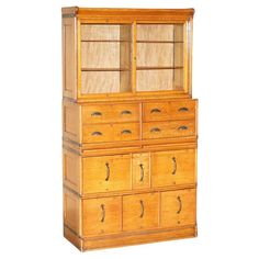 an old fashioned wooden cabinet with drawers