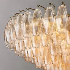 a chandelier that has many glasses hanging from it