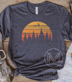 This shirt makes the perfect gift for someone who loves forests, hiking, and camping. Forest Sunset Shirt Tree Nature Shirt Retro Sunset Graphic Summer Vacation Up North Tee Wisconsin Hiking Shirt Camping Sweatshirt Bellas Canvas 3001T:  T-Shirt Sizing Please reference the size chart before selecting shirt size.  Use one of your own t-shirts to measure the size and fit.  Then compare with the size chart provided to ensure an accurate fit. T-Shirt Materials 100% combed and ring-spun cotton. Heath Casual Crew Neck Camp Shirt For Outdoor Activities, Fall Hiking T-shirt With Graphic Print, Casual Cotton Camp Shirt For Adventure, Casual Graphic Print Camp Shirt For Hiking, Short Sleeve Shirt For Outdoor Fall Activities, Short Sleeve Shirt For Fall Outdoor, Cotton T-shirt For Outdoor Fall Activities, Casual Screen Print Shirt For Camping, Cotton Camp Shirt With Crew Neck For Adventure